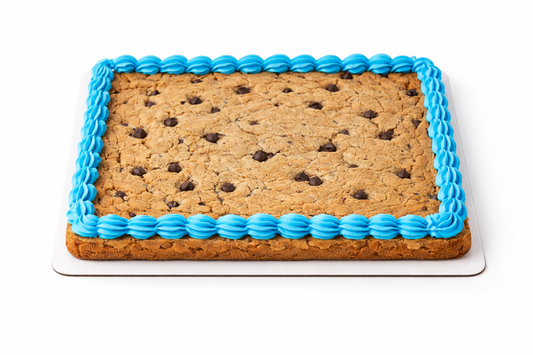 Rectangular cookie cake with blue icing border on a white background.